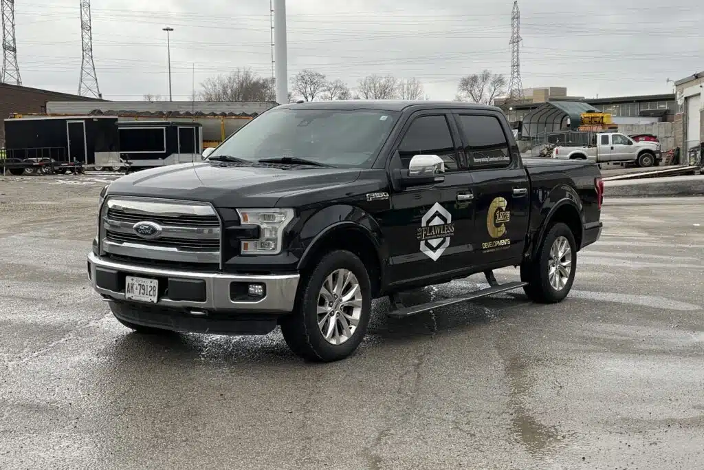Side view of Ford F-150 featuring bold 3M lettering and decals installation by Branding Centres