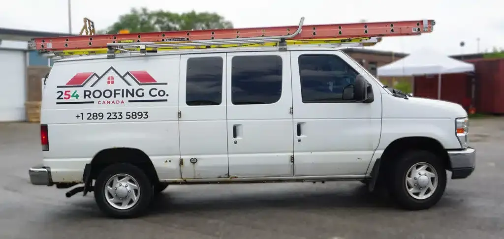 Side view of Ford E-150 commercial lettering and decals installation by Branding Centres