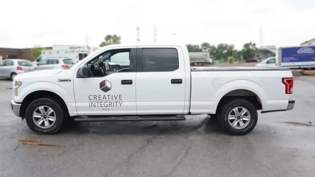 Side view of Ford F-150 displaying Etobicoke Lettering and Decals installed by Branding Centres
