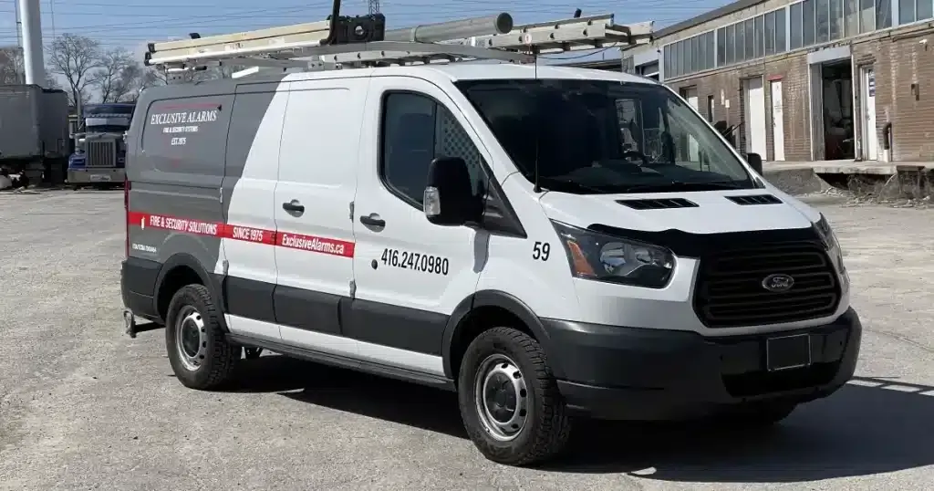 Ford Transit Partial Van Wrap for Exclusive Alarms - Angle Side