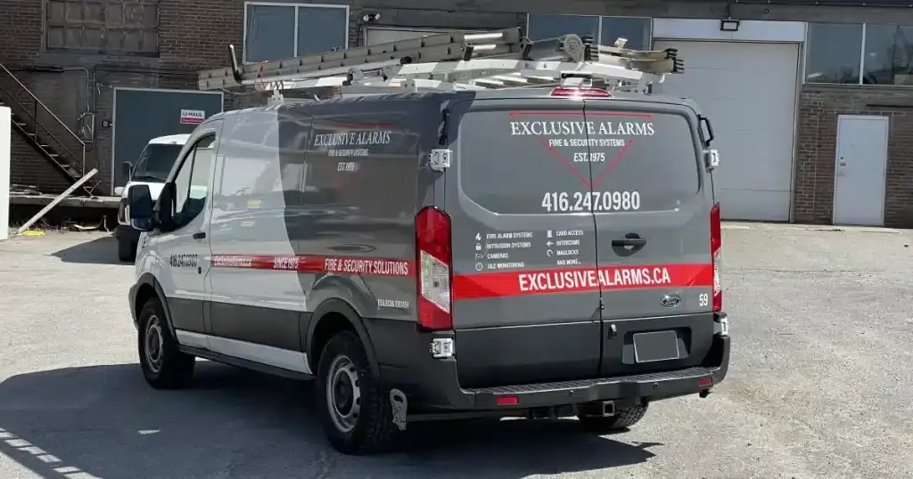 Ford Transit Van Partial Wrap for Exclusive Alarms - After - Back Angle View Ford Transit Van Partial Wrap for Exclusive Alarms - After - Back Angle View