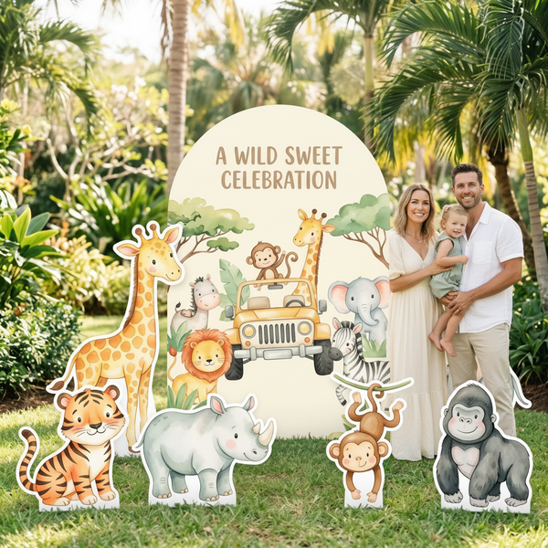 A Wild Sweet Celebration Safari Backdrop Set with giraffe, elephant and monkey standees