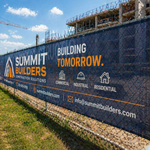 Custom mesh banner on construction site fence – outdoor vinyl mesh banner printing