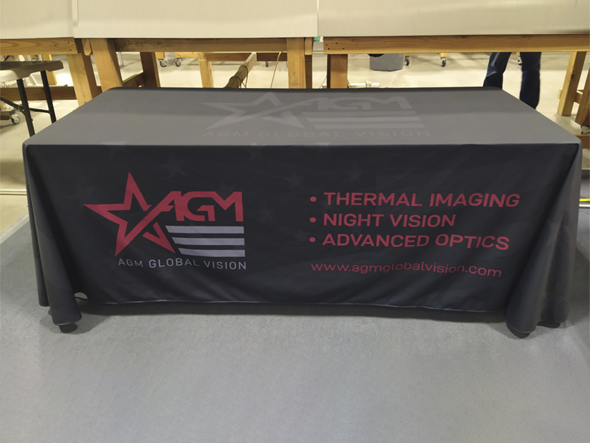 Table throw showing AGM Global Vision logo and company highlight points.