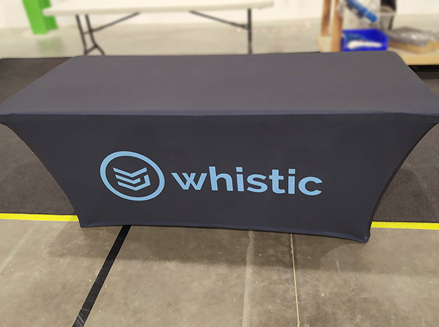 Navy blue table cloth with light blue Whistic logo