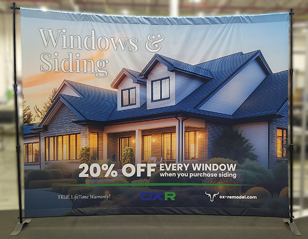 Windows and Siding, lovely home early evening with windows lit up. OX Windows.