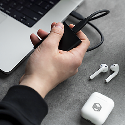 Photograph showing a serving line, with a man handing a plate of food to a woman who has a forearm cruth.
