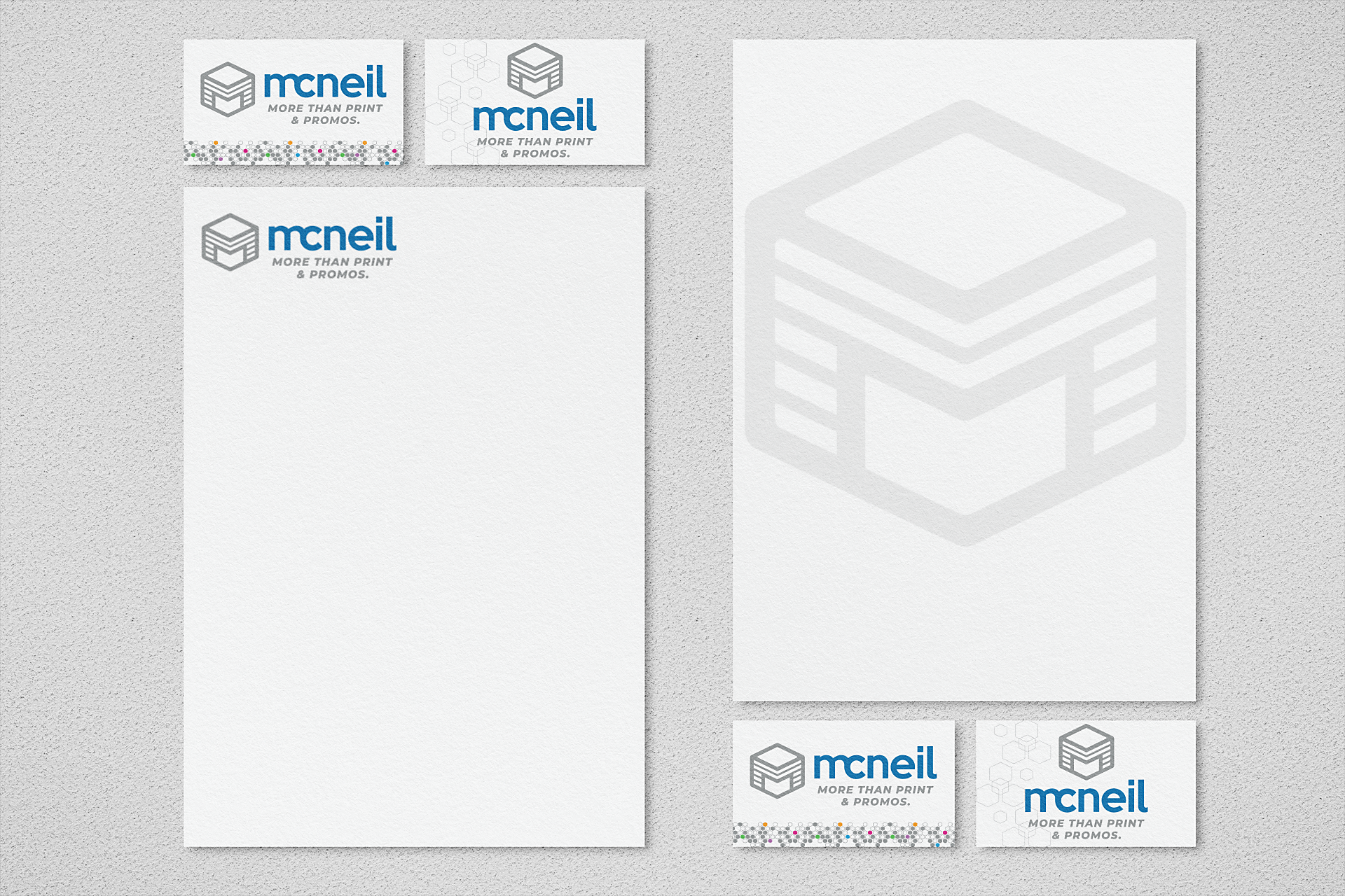 Graphic Letterhead and two styles of McNeil Prnting Promo business cards.