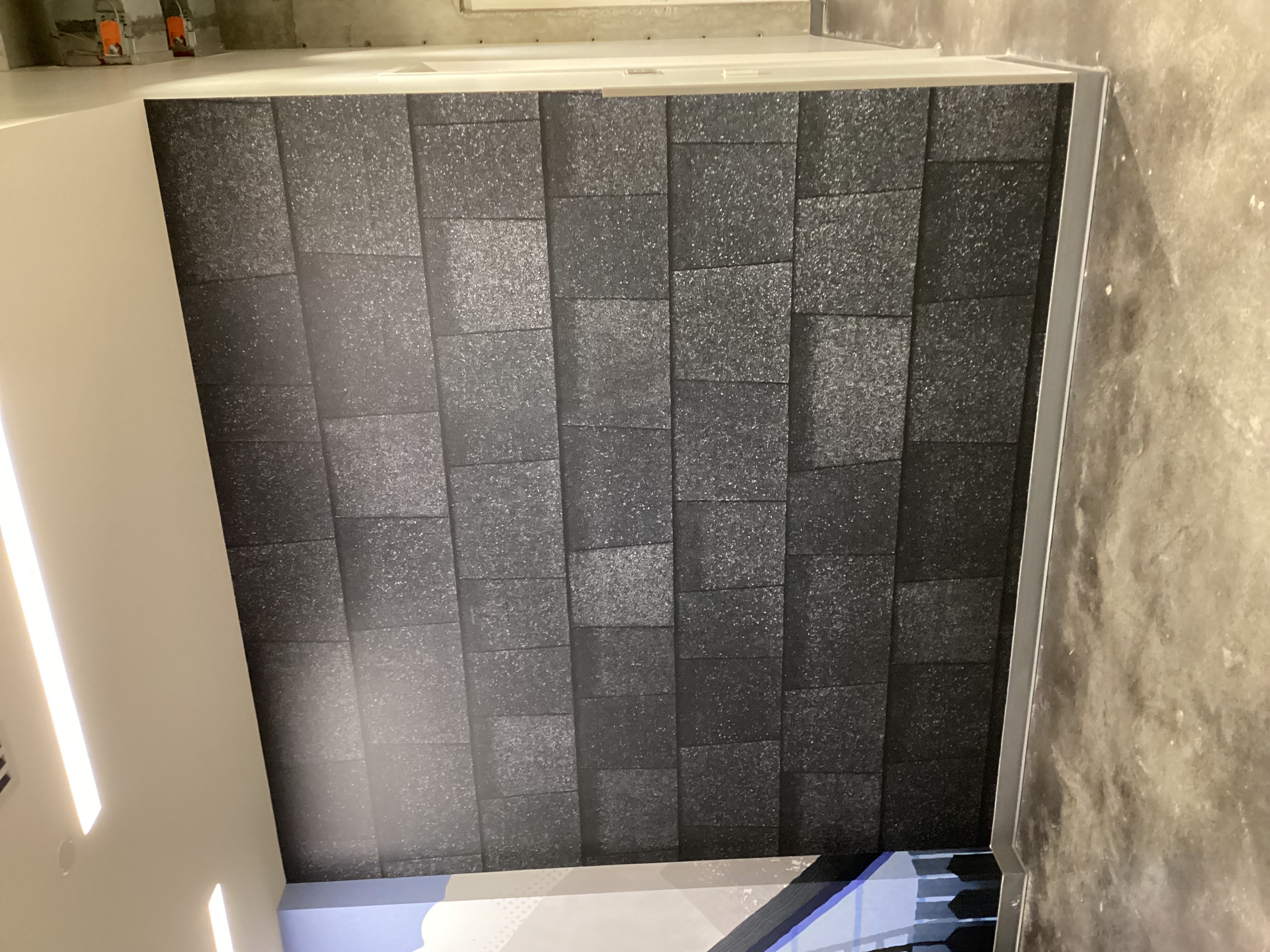 Interior wall with vinyl shingle-pattern wallpaper