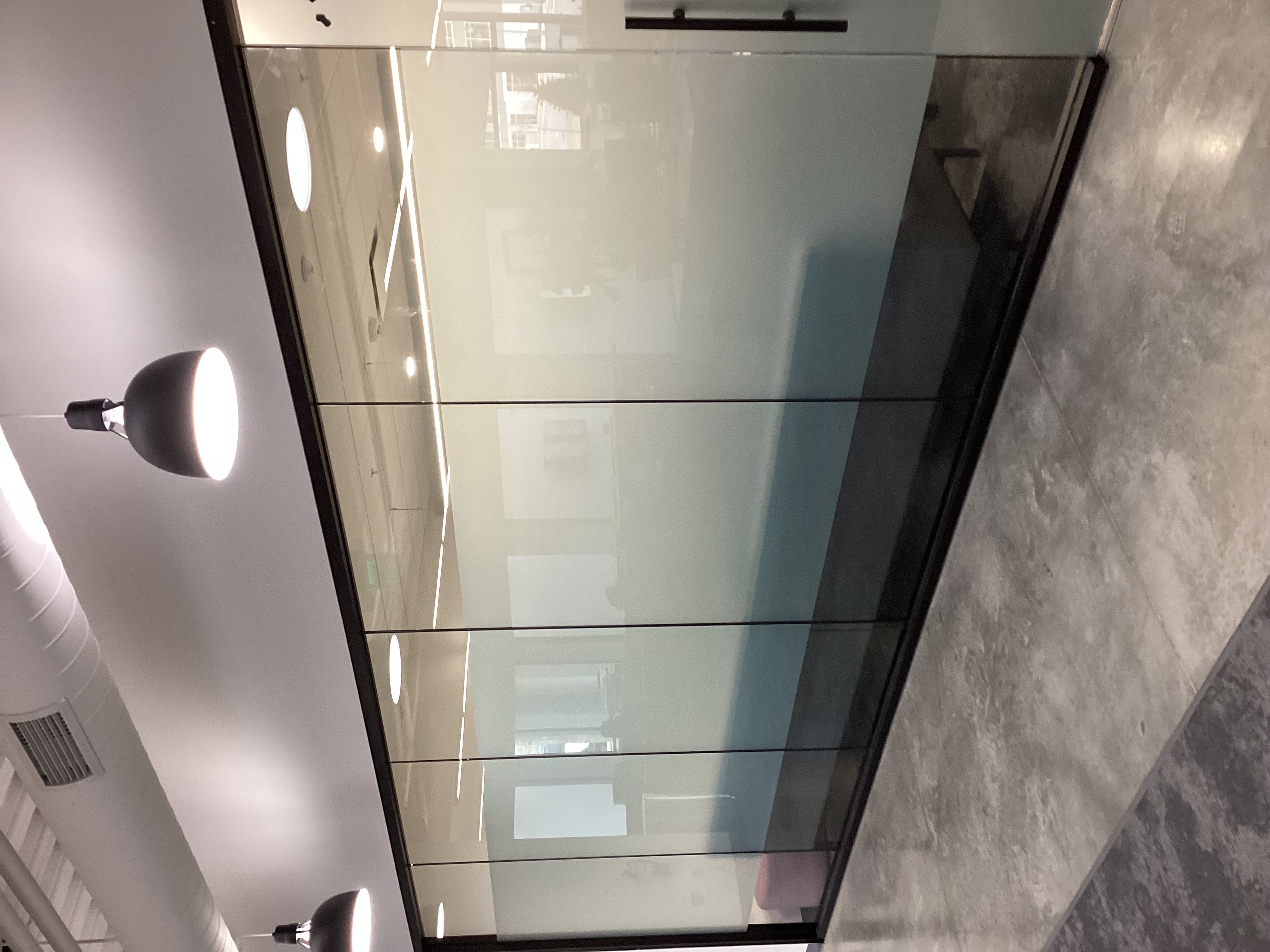 Conference room with a privacy vinyl strip in the middle.