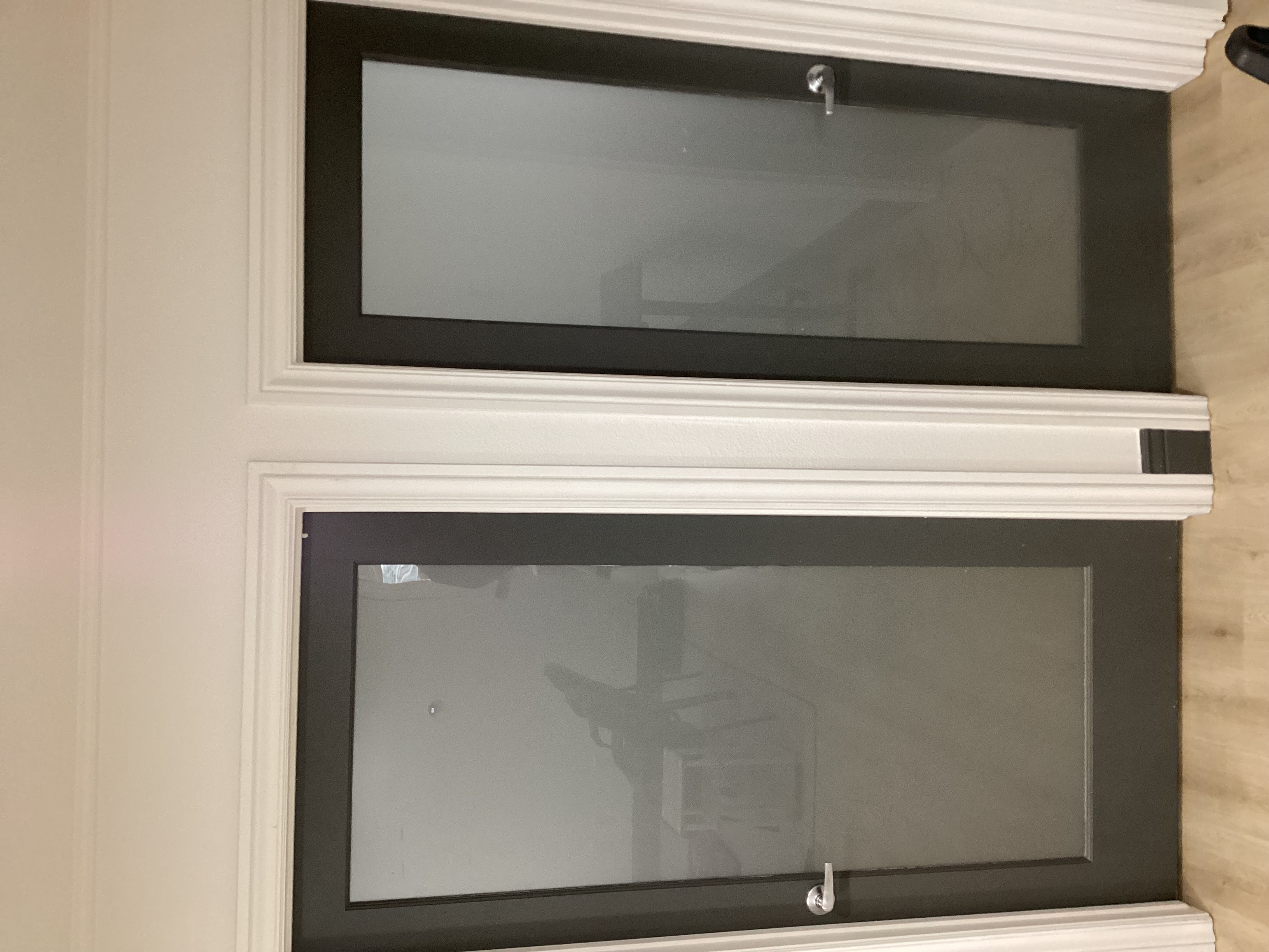 Two seperate doors with glass covered with privacy vinyl.