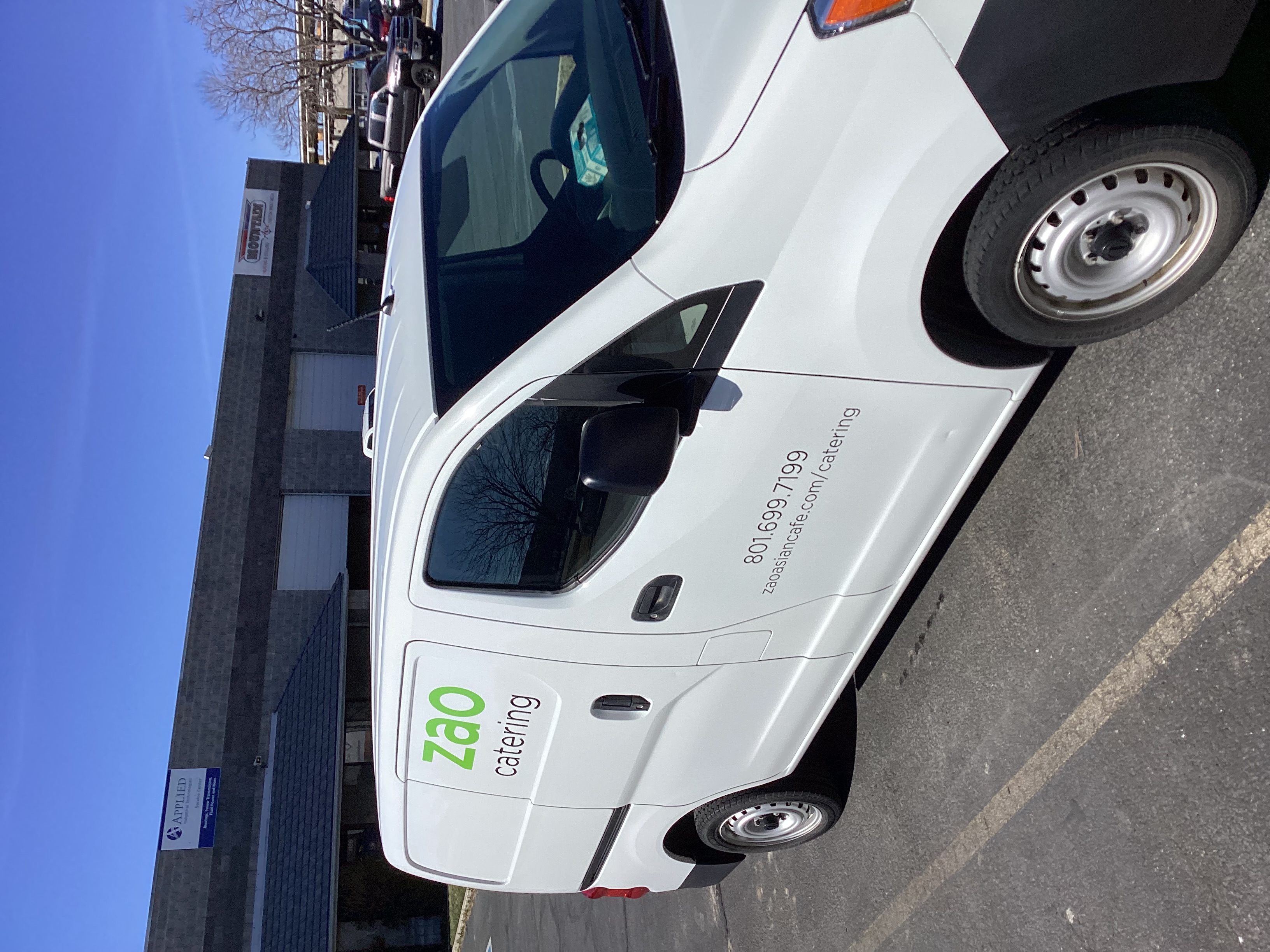 White van with vinyl lettering for catering.