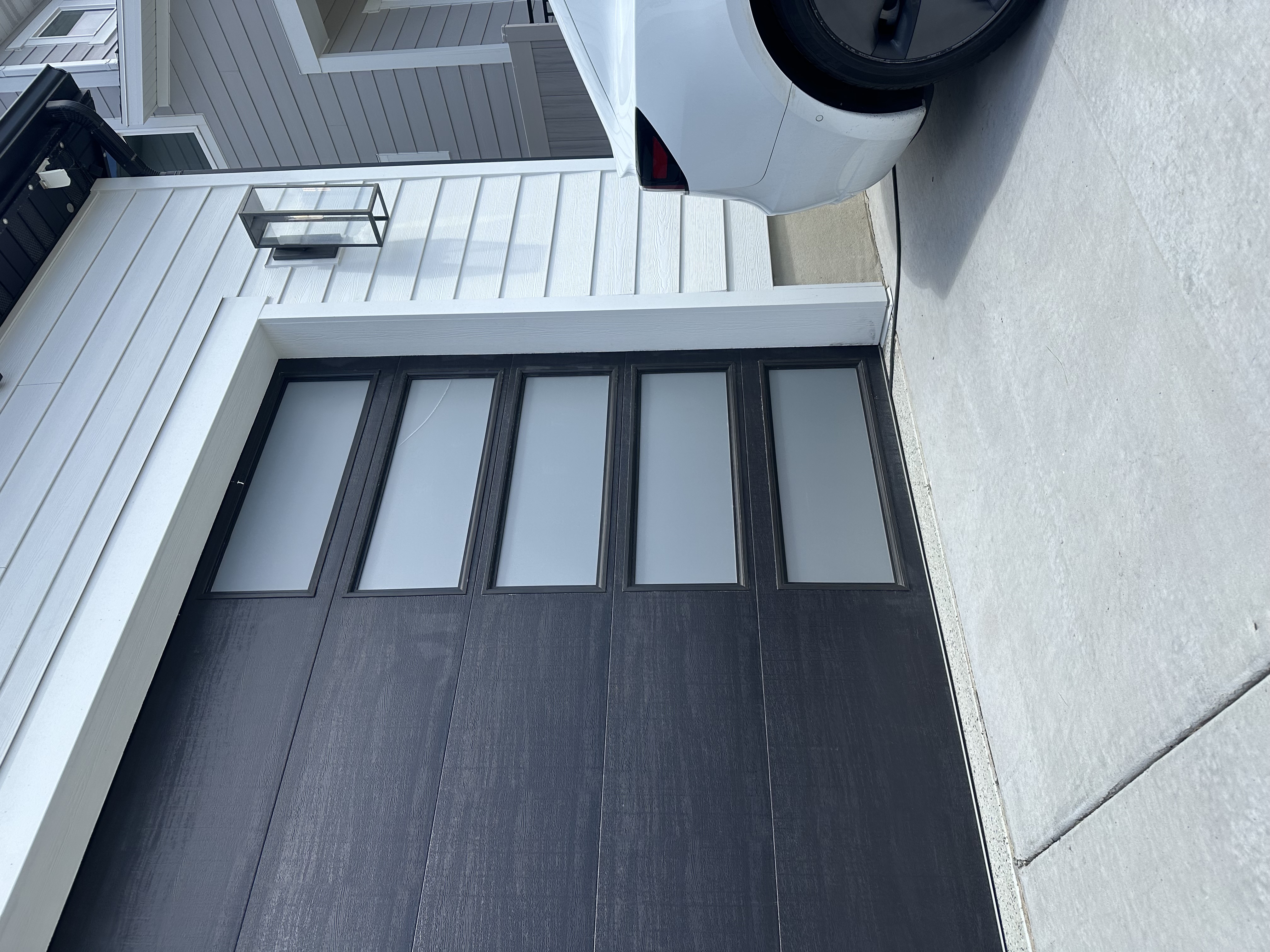 Garage with glass five glass windows, down left side, with privacy vinyl.