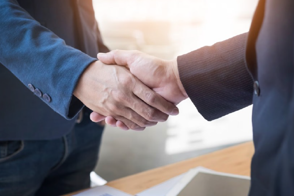 Image showing close up of two hands clasped and shaking.