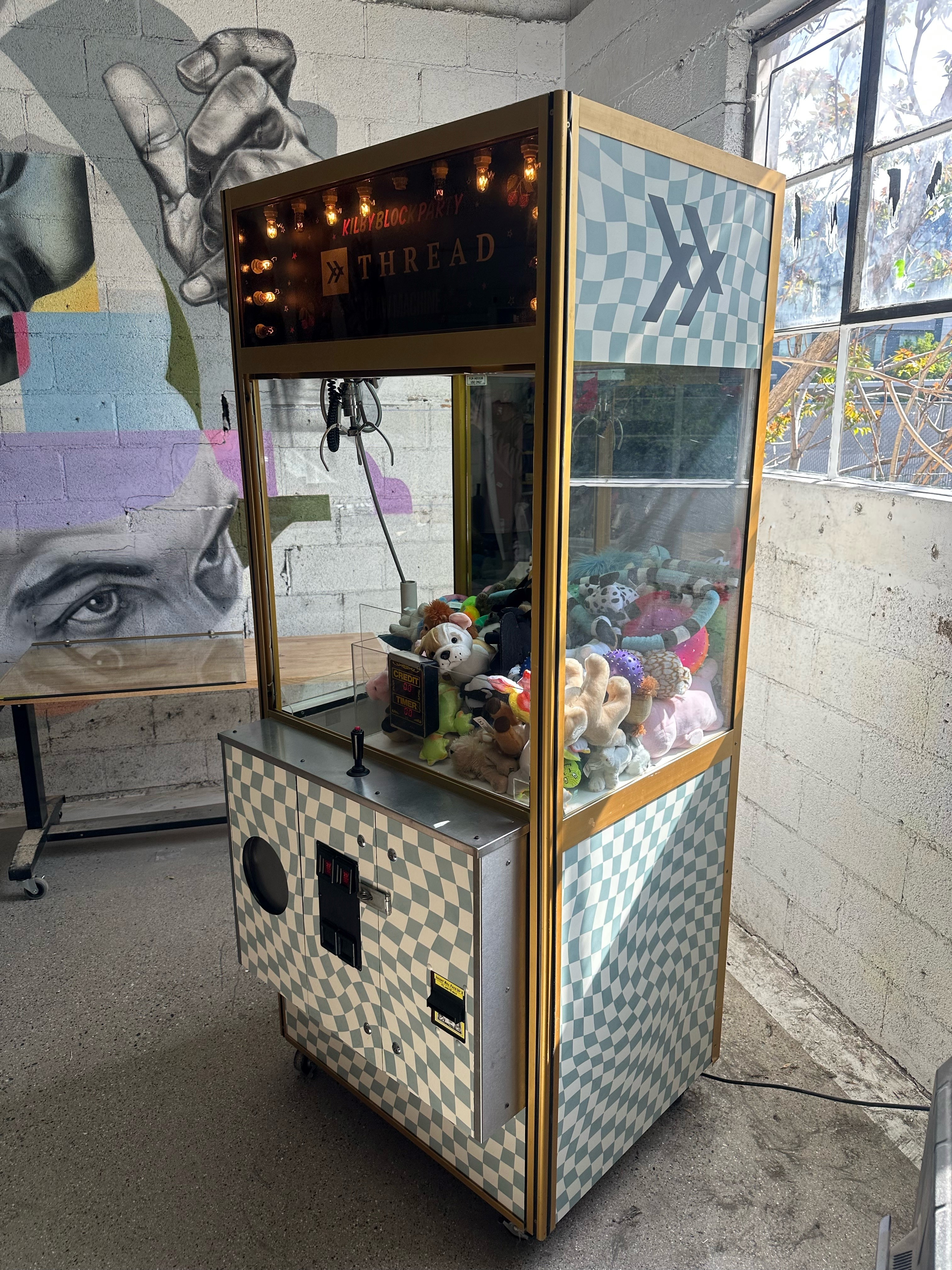 Claw machine wrapped with vinyl for company branding.