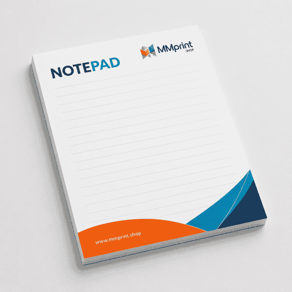 Custom notepad printing with branded spiral lined notepad on a desk with laptop, pen, and plant.
