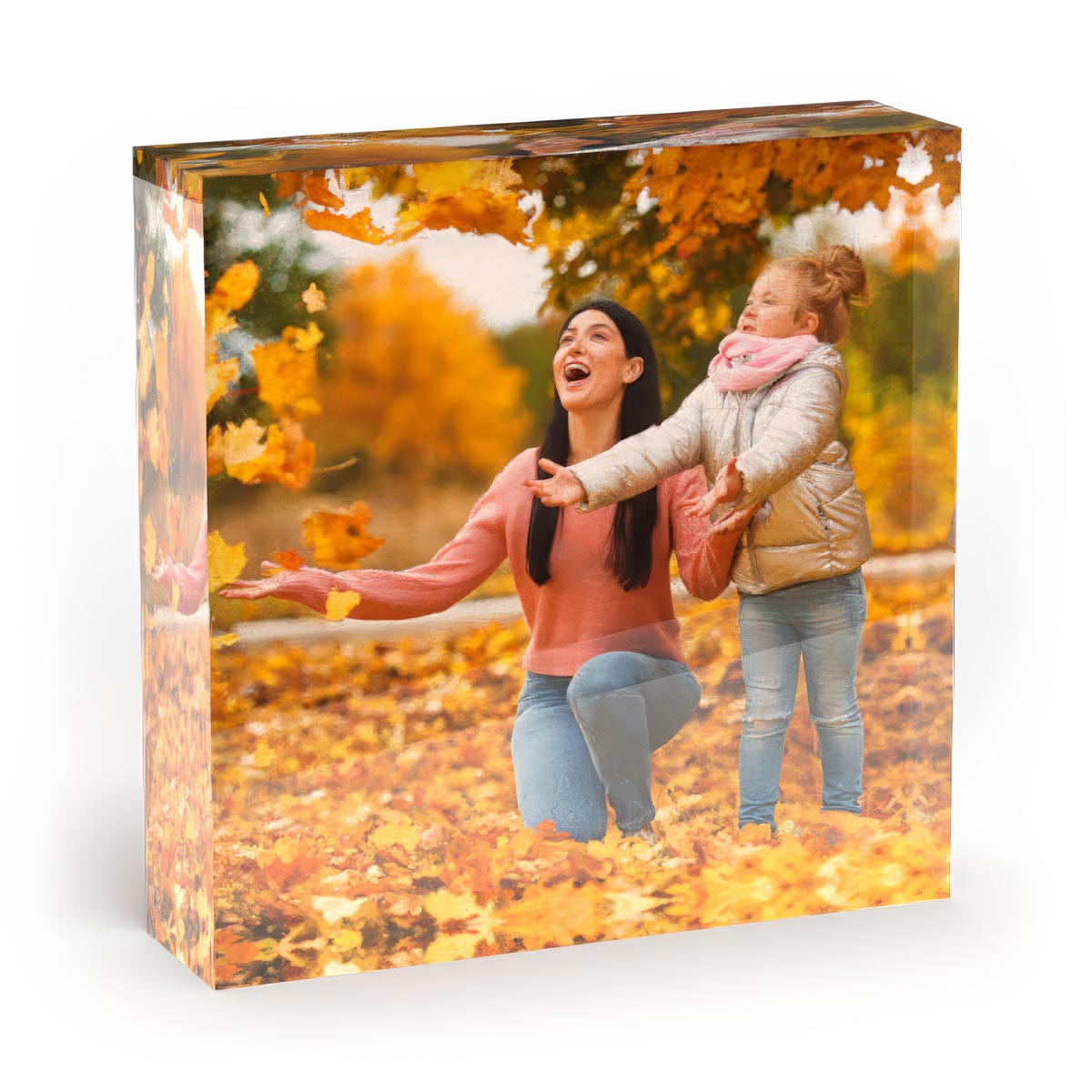Acrylic Photo Blocks Freestanding thick acrylic photo block displaying a vibrant family photo in autumn leaves, showing the crystal-clear depth.