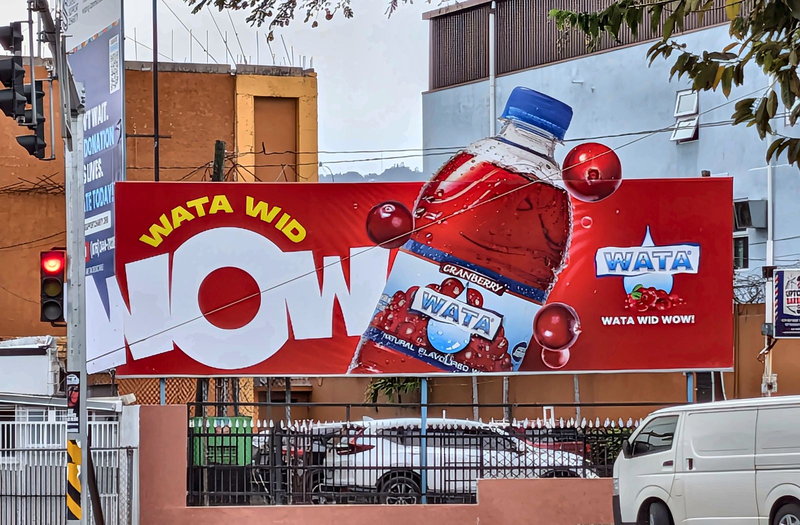 Wata Wid Wow billboard with the bottle and W cut out past the frame, printed and installed by Print Big