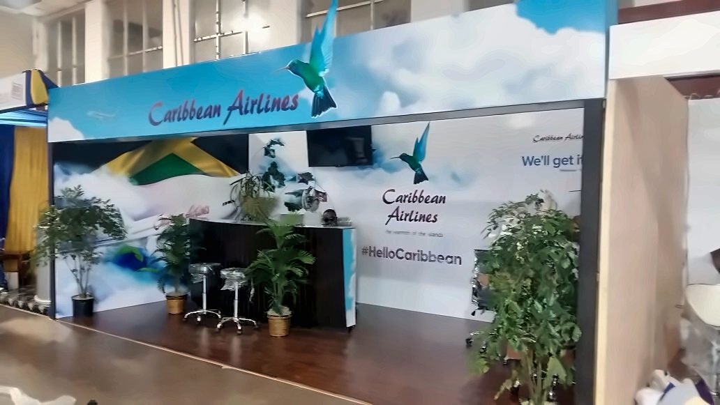 Caribbean Airlines exhibition booth with full-width branded wall
