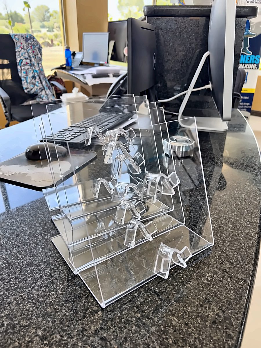 Set of clear acrylic display stands on a granite counter