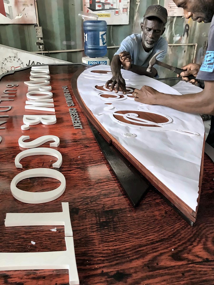 Hand-finished timber sign with raised lettering