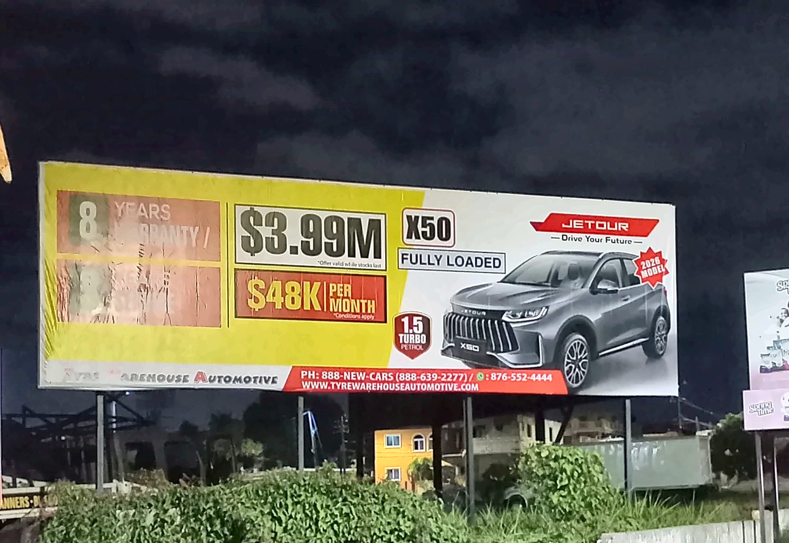 Jetour X50 billboard at night