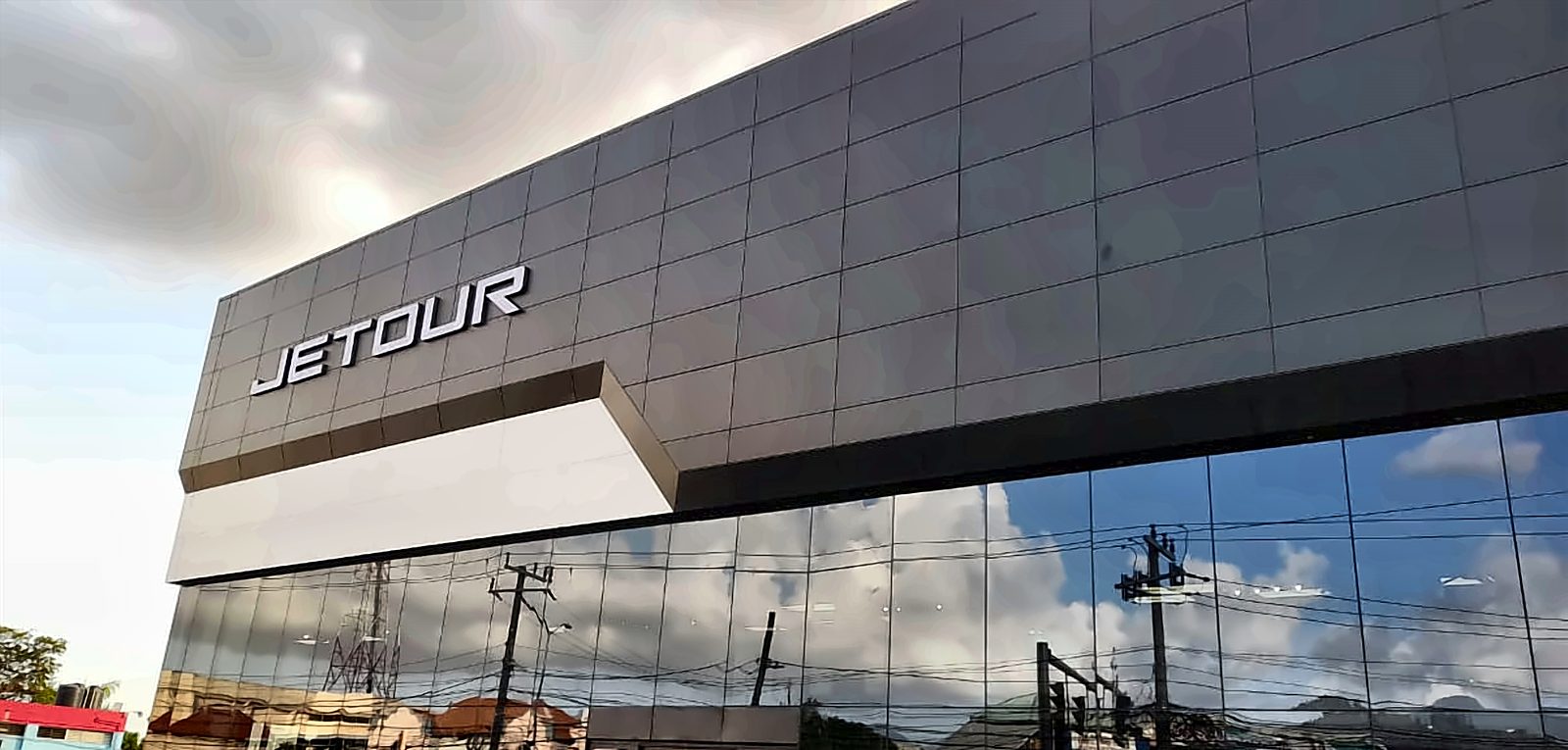 JETOUR lettering on the Tyre Warehouse Automotive showroom building