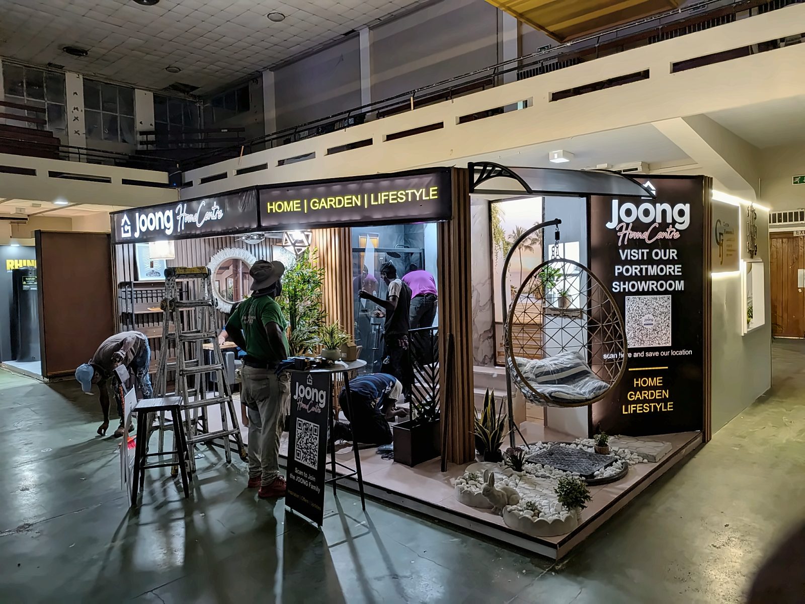 Booth near completion with crew finishing details