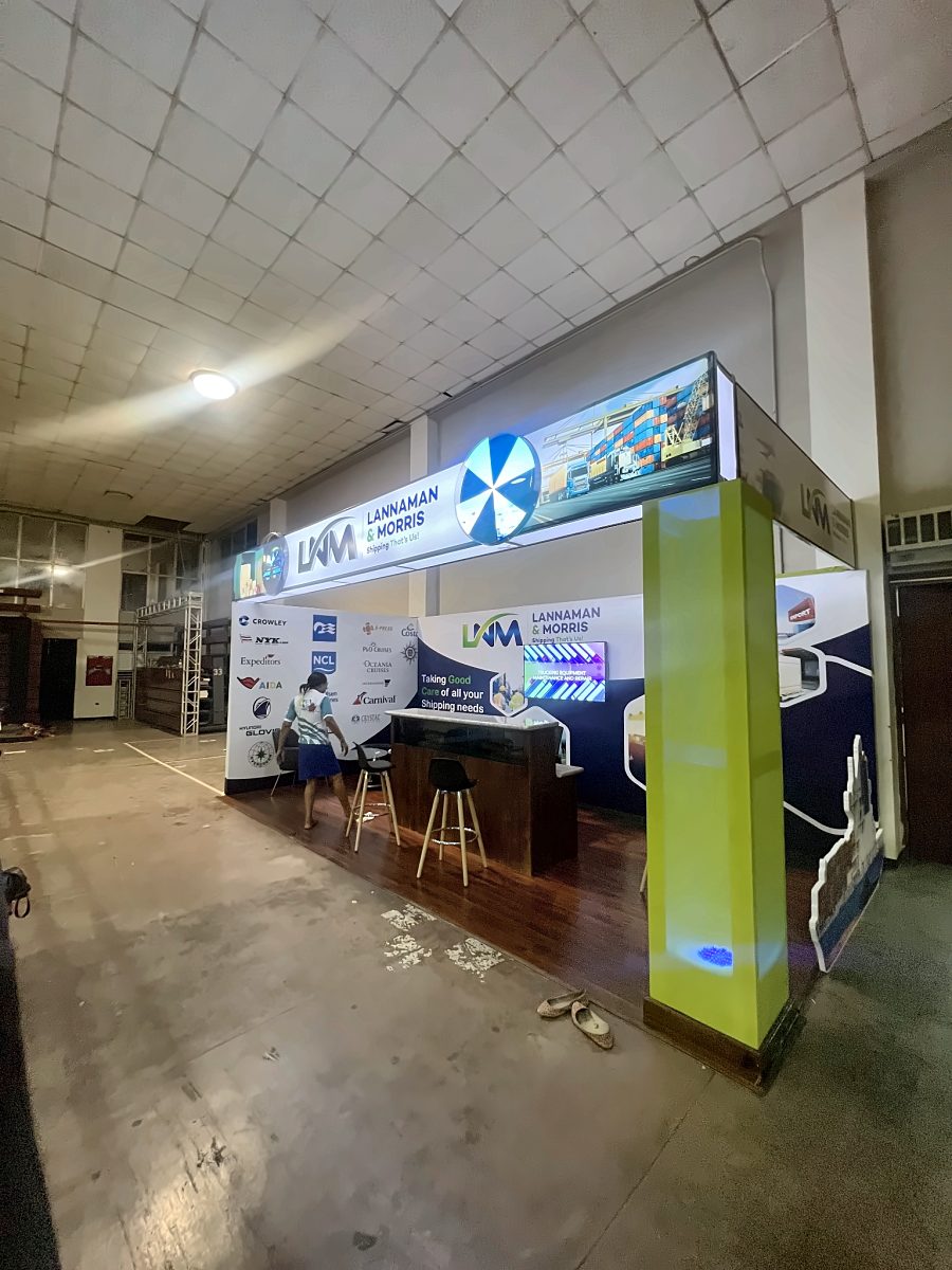 Lannaman & Morris exhibition booth with a lit header