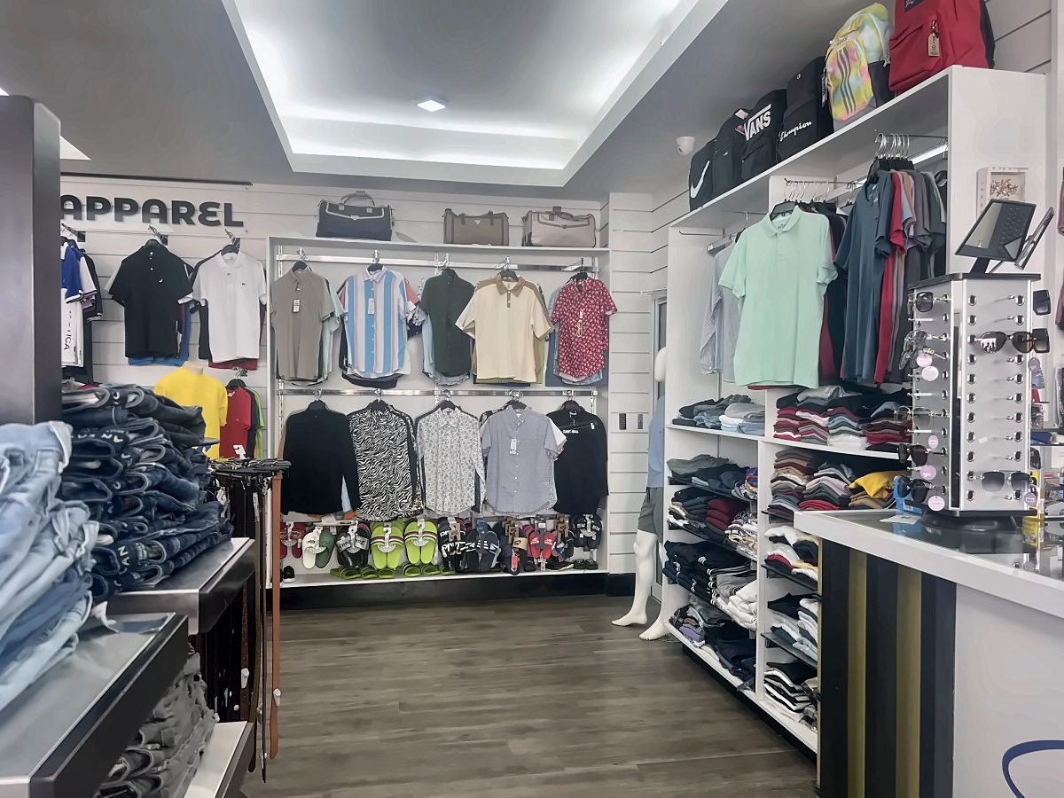 Branded retail store interior with wall fixtures for apparel