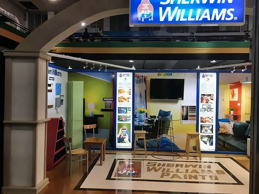 Sherwin-Williams exhibition booth with a lit header and branded floor