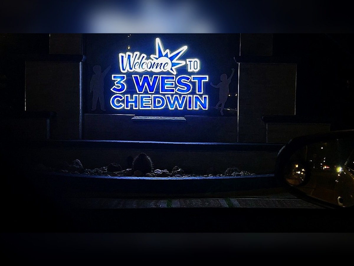Lit entrance sign · 3 West Chedwin