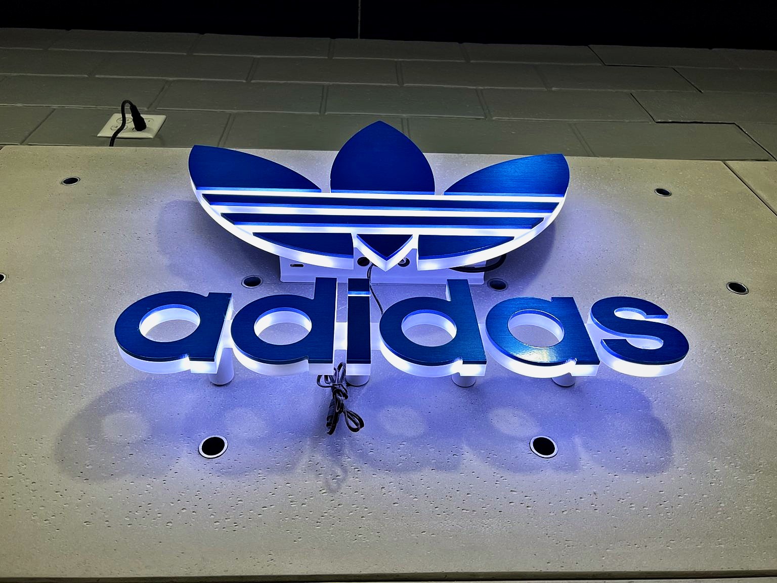 Backlit 3D logo · Adidas