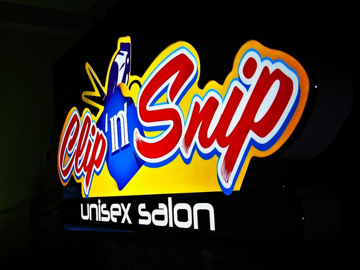 Illuminated sign · Clip n Snip Unisex Salon