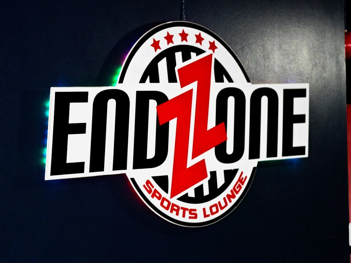 Illuminated logo sign · Endzone Sports Lounge