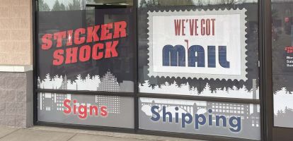 Front window with stamp logo for We've Got Mail