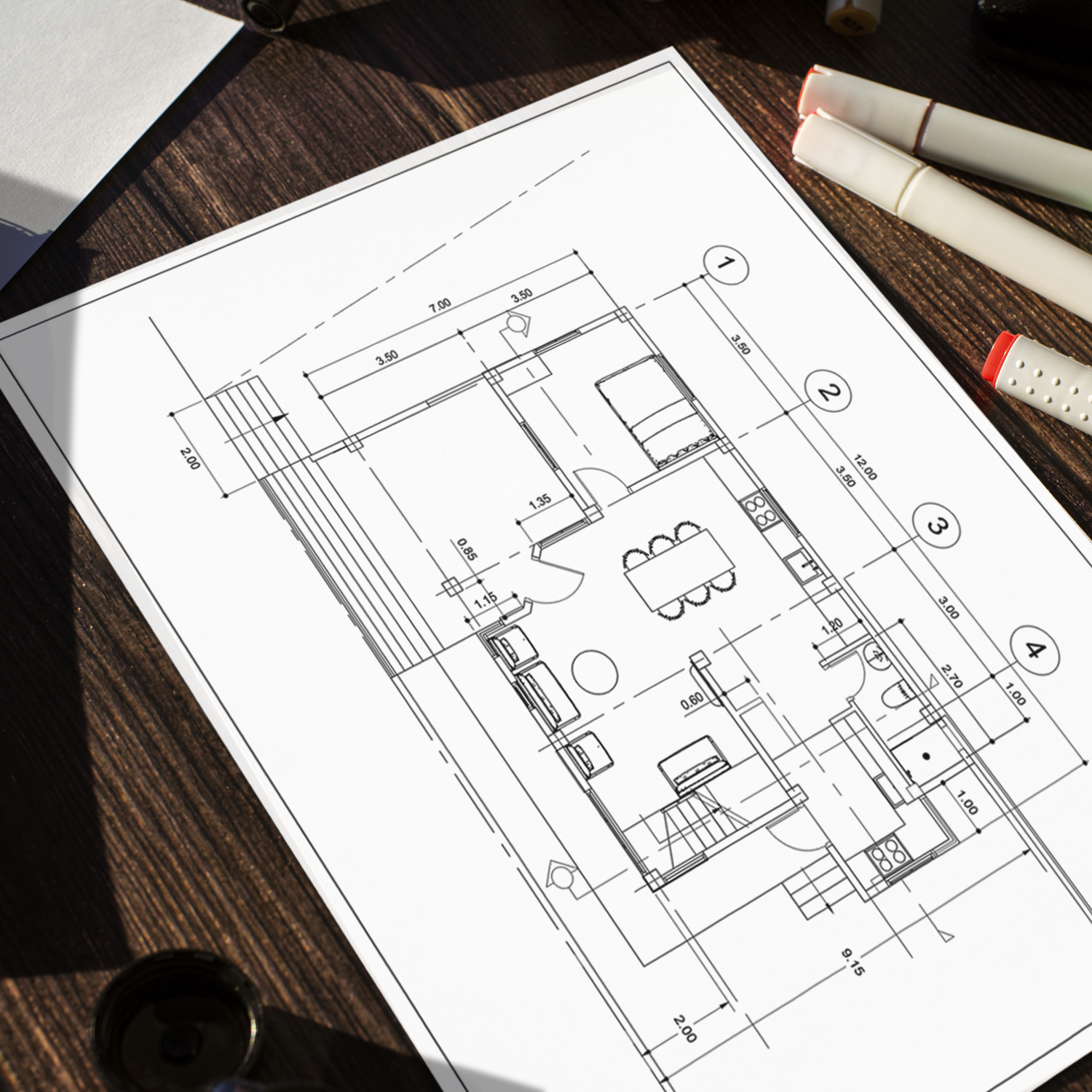 Blueprint with house plans on a table with tools