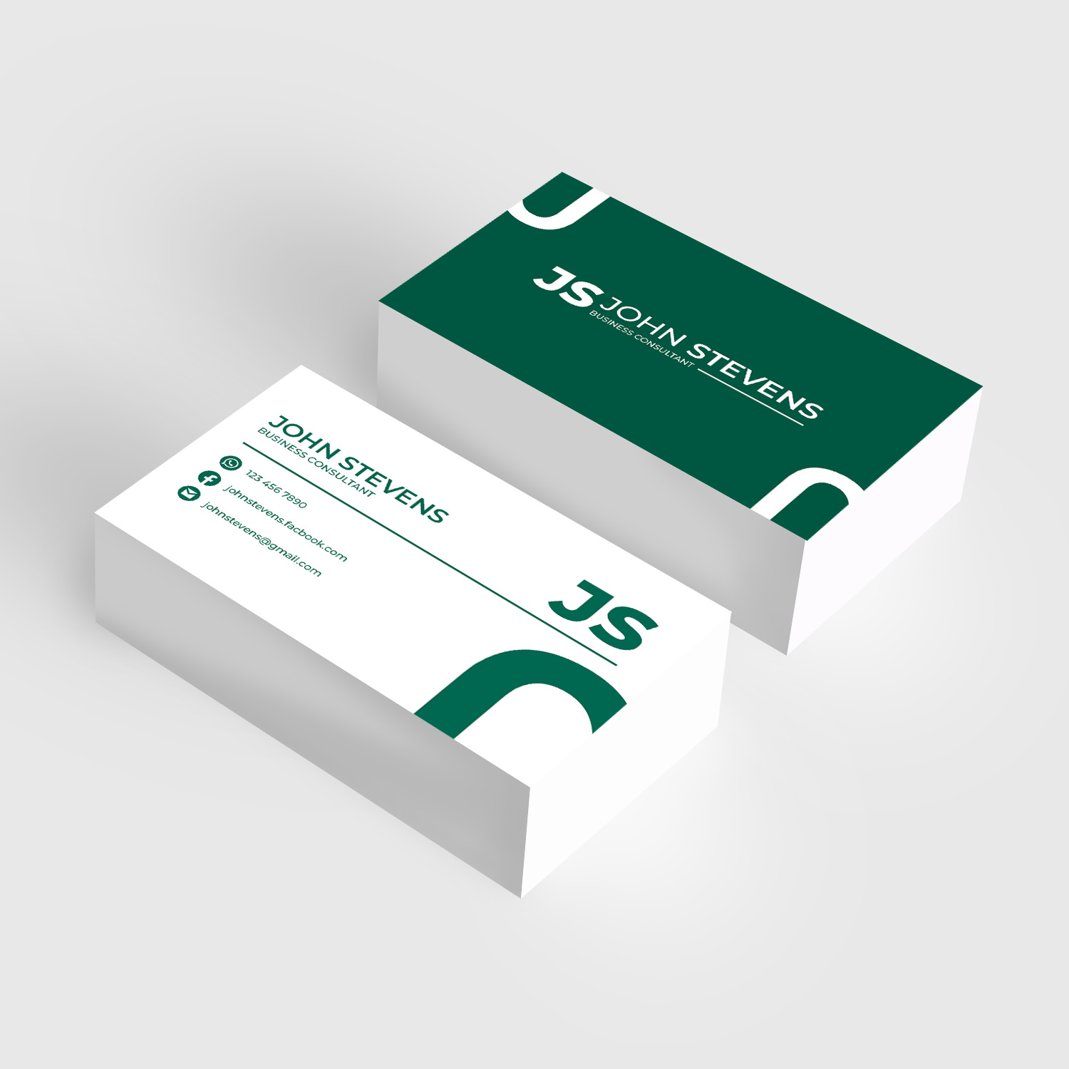 Two stacks of business cards on a light desk