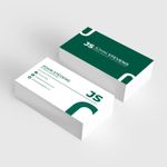Two stacks of business cards on a light desk